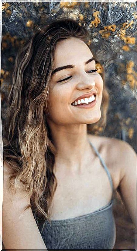 Woman laughing in nature