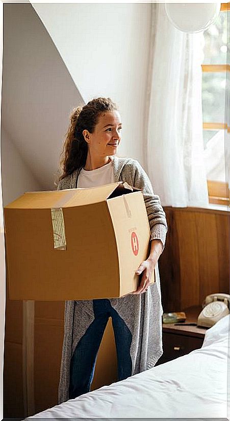 Woman with cardboard box